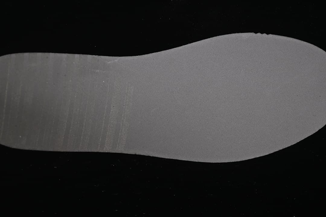 Gray-toned outsole shown from below.