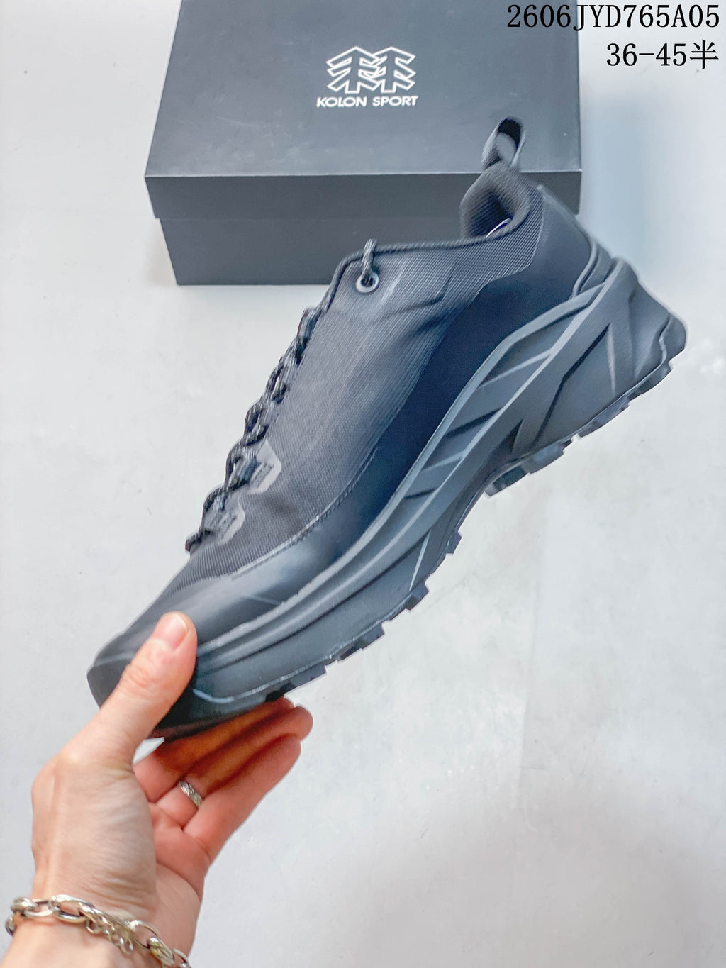 Side view of the low-cut hiking shoe with mesh upper and rugged outsole