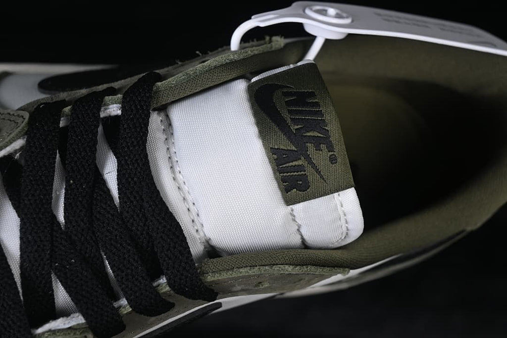 Close-up of the tongue label and black laces