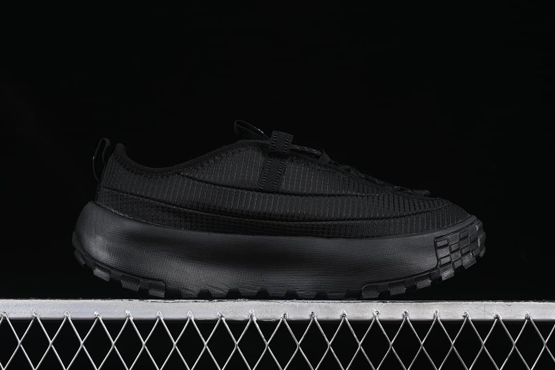 Side profile of the black low-top shoe