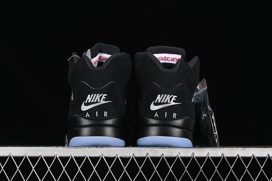 Rear view of both shoes showing Nike Air heel branding