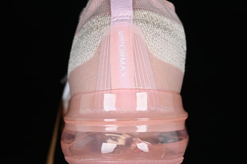 Rear view of the shoe with VaporMax branding and a transparent pink-toned sole.