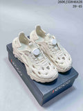 Off-white perforated clog-style sandals with adjustable lacing, shown on a branded box.