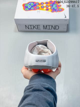 Heel view of the white slide showing the rear pull area and sculpted outsole.