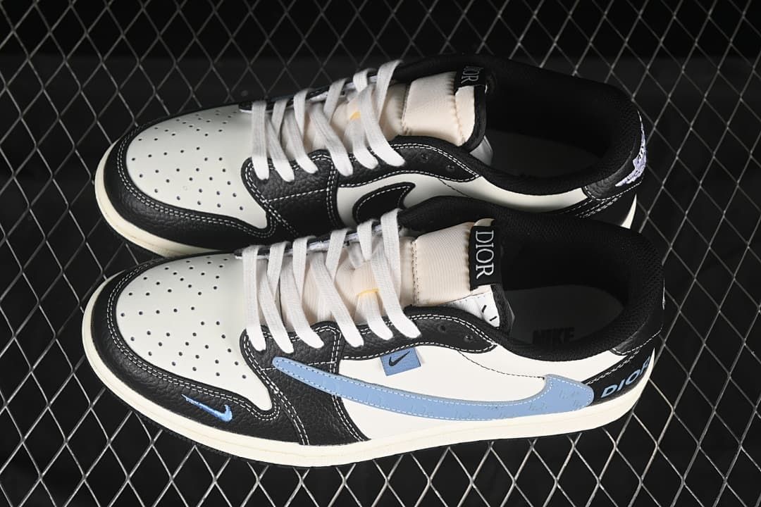 Top view of a pair of black, white, and pale blue low-top sneakers with white laces and Dior tongue labels