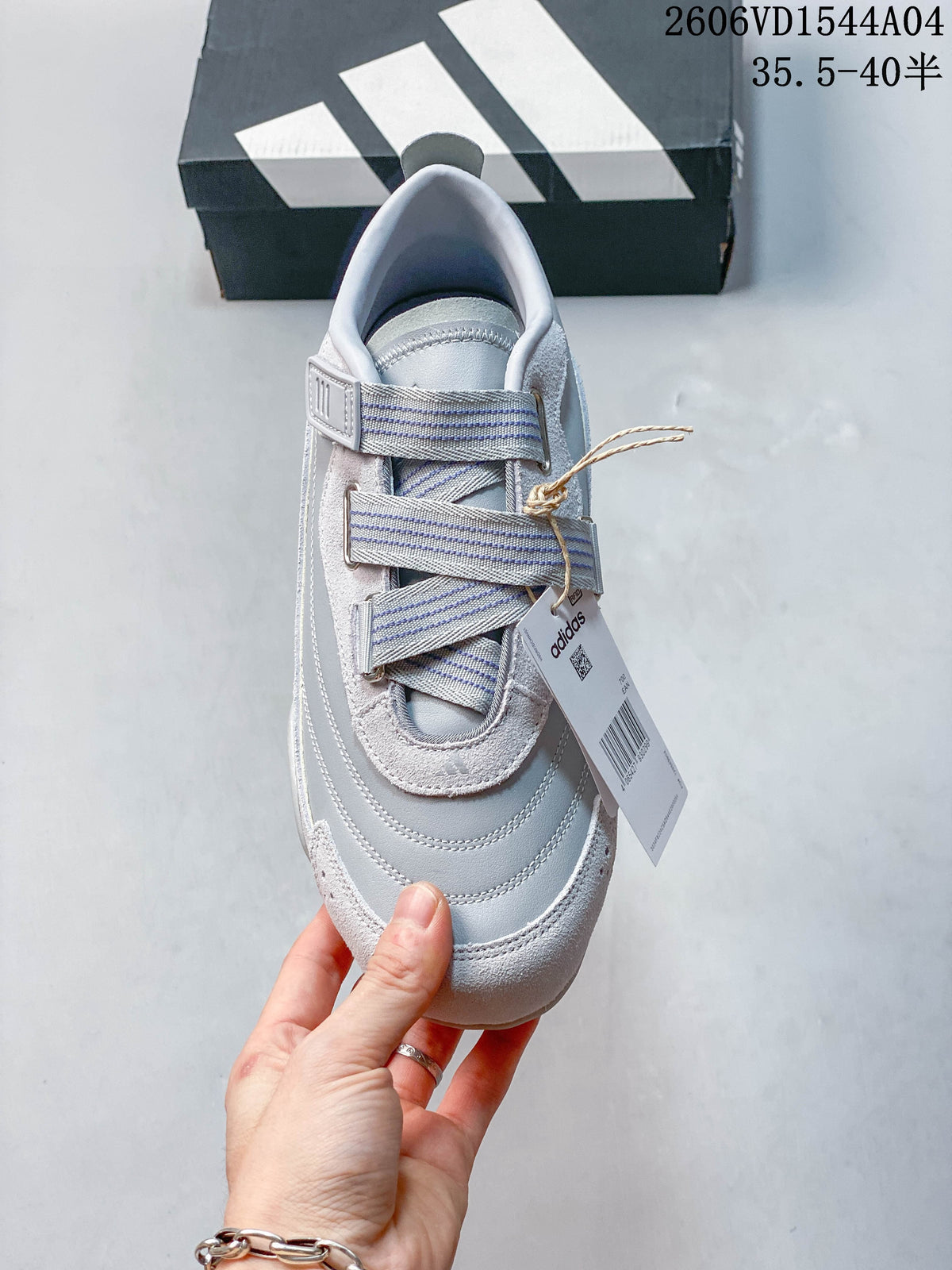 Top view of the Adidas sneaker highlighting its striped hook-and-loop straps