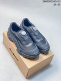 Pair of gray ECCO BIOM shoes with dial closures, shown on a box