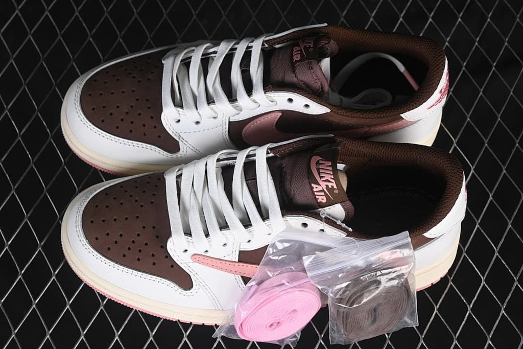 Pair of brown, white, and pink low-top sneakers shown with pink and brown spare laces.