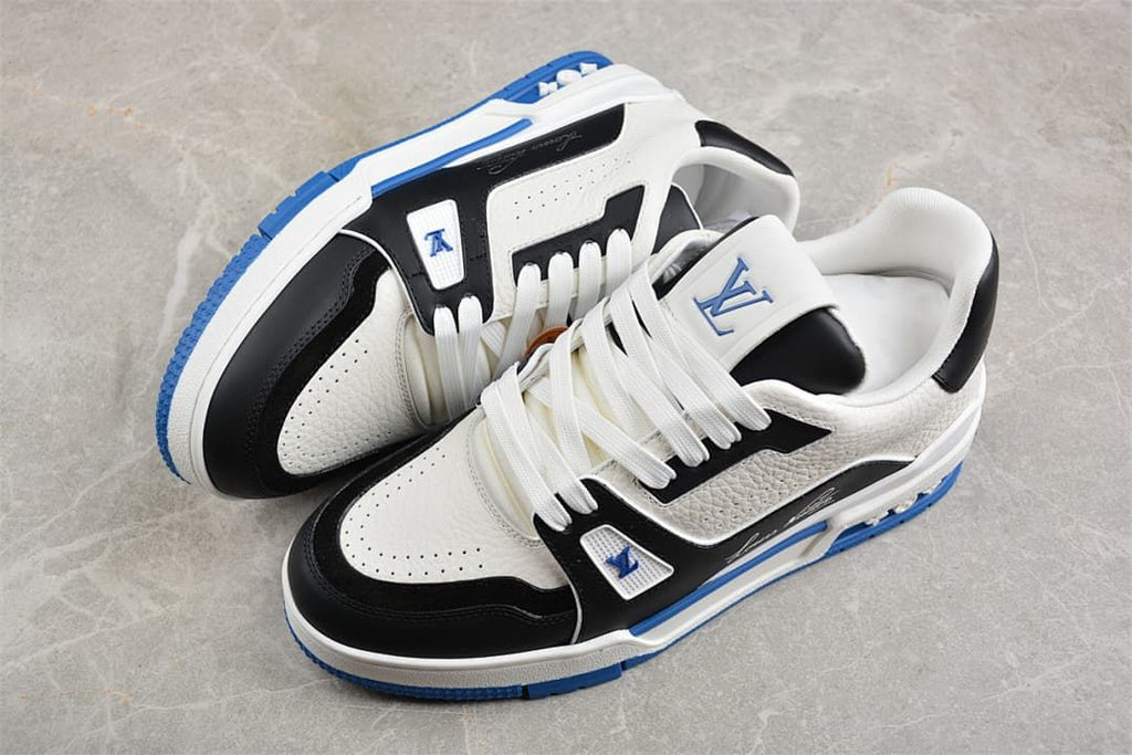 Pair of white, black, and blue low-top LV Trainer sneakers