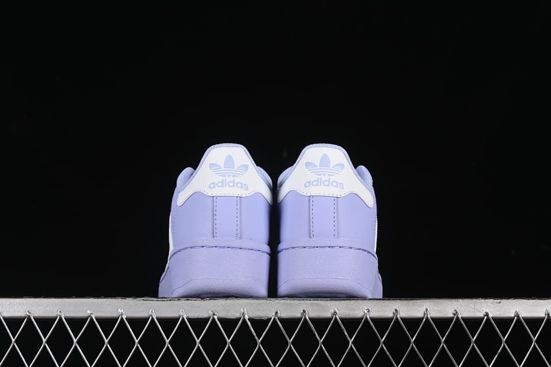 Rear view of both sneakers showing heel tabs and platform-style soles