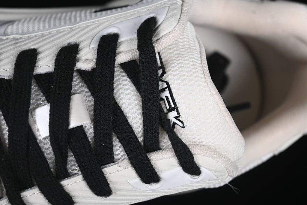 Close-up of black laces and the tongue area