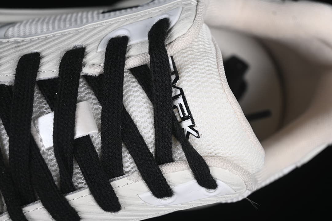 Close-up of black laces and the tongue area