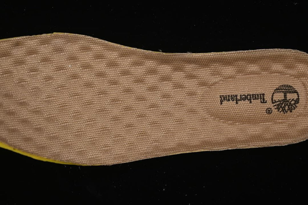 Close-up of the tan textured footbed with Timberland branding