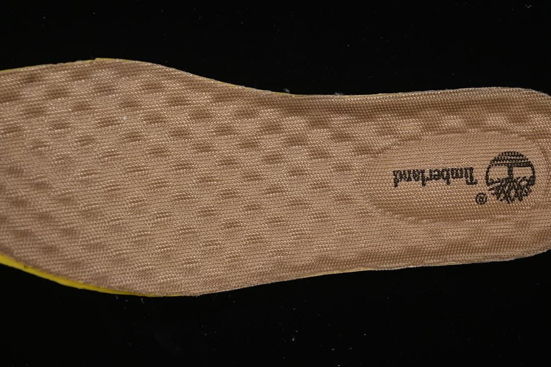 Close-up of the tan textured footbed with Timberland branding