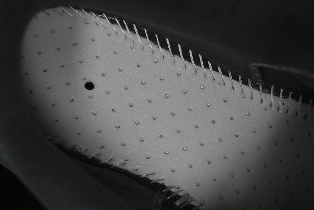 Close-up of textured outsole and stitching