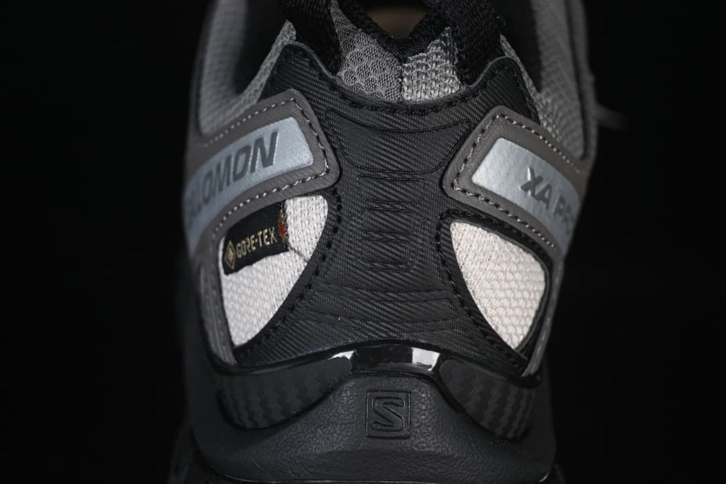 Rear close-up showing Salomon and XA Pro details, plus a Gore-Tex badge.