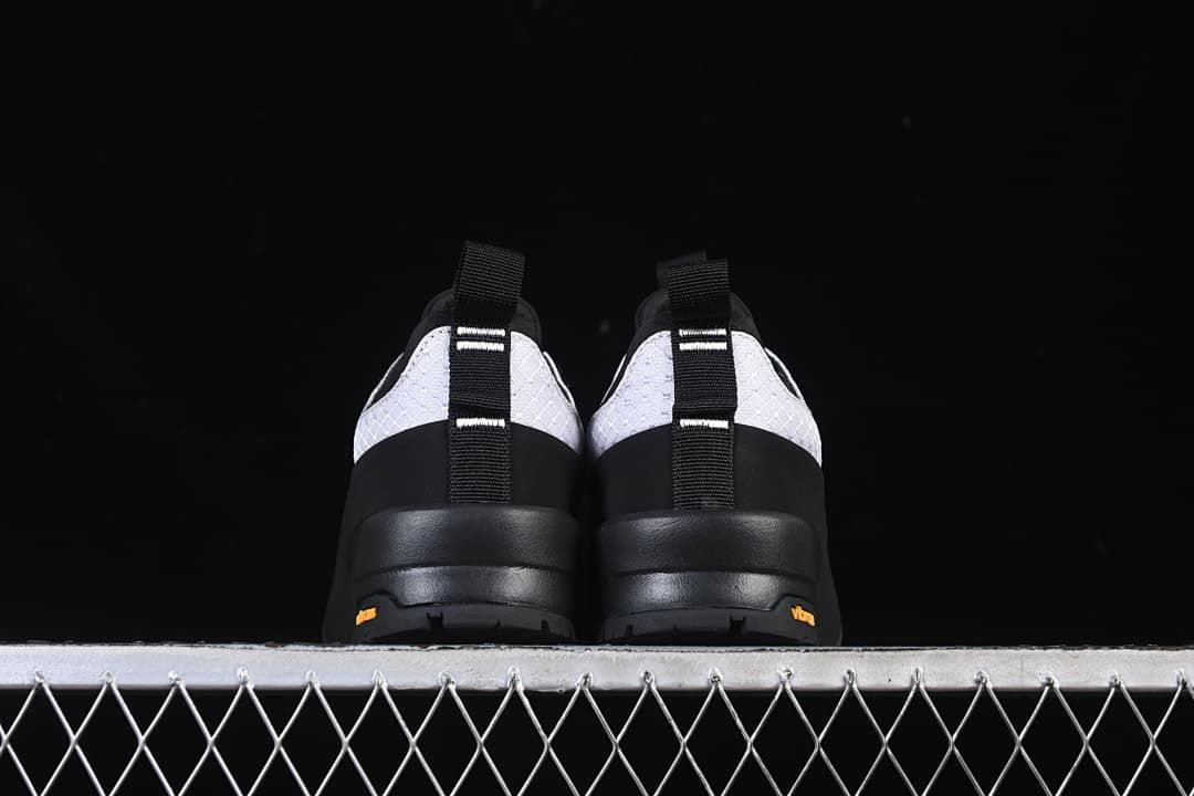 Rear view of both shoes showing heel pull tabs and outsole.