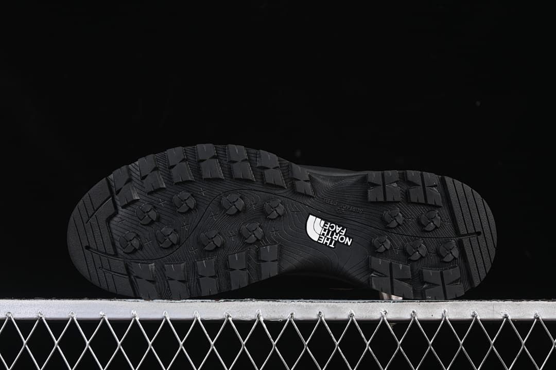 Underside view showing the boots' lugged tread pattern