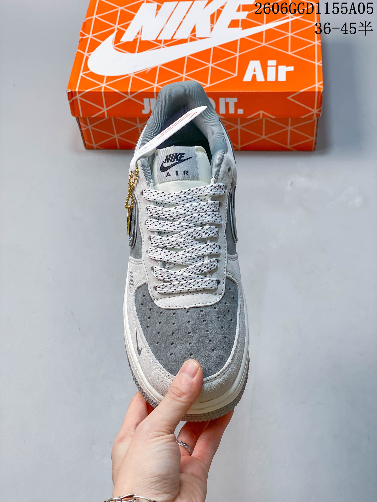 Front view of a Nike Air Force 1 sneaker showing the perforated toe and patterned laces