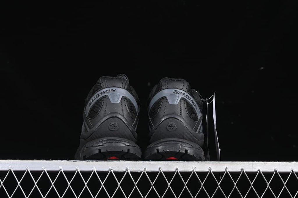 Rear view of the pair showing heel panels and outsole edges.