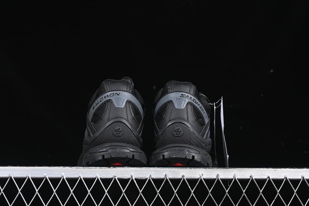 Rear view of the pair showing heel panels and outsole edges.
