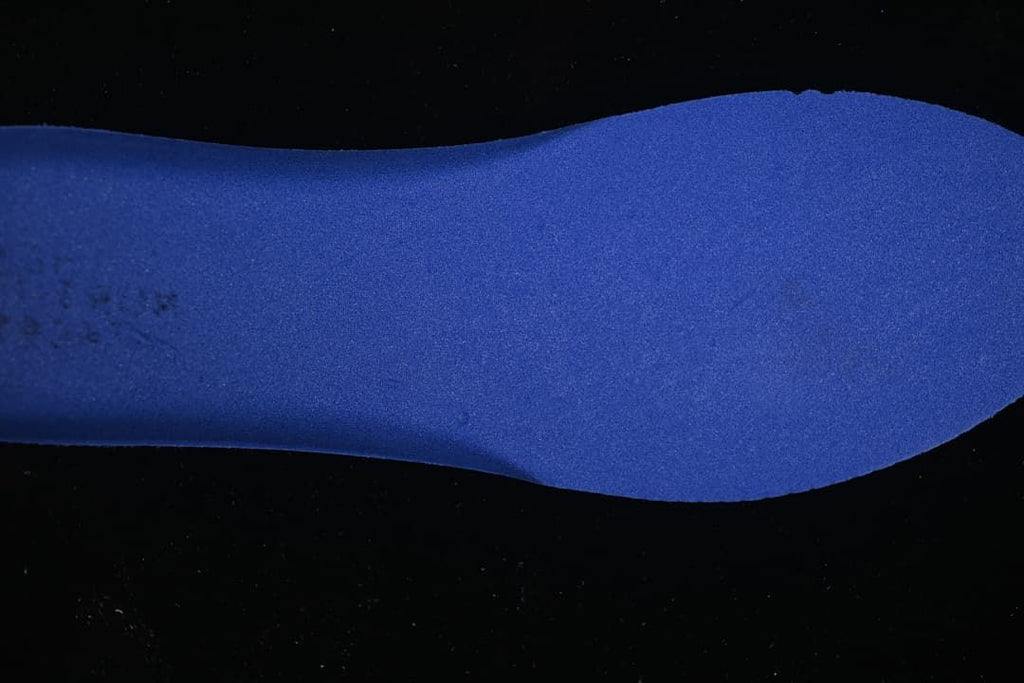 Blue foot-shaped insert shown against a dark background