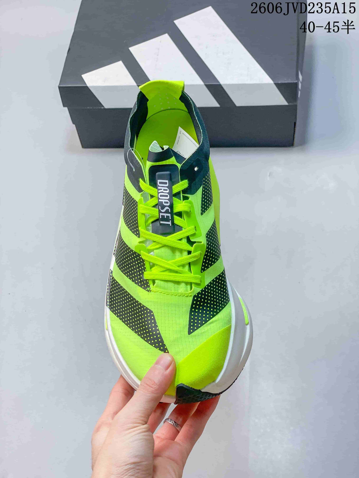 Top view showing the laces, tongue label, and neon green upper