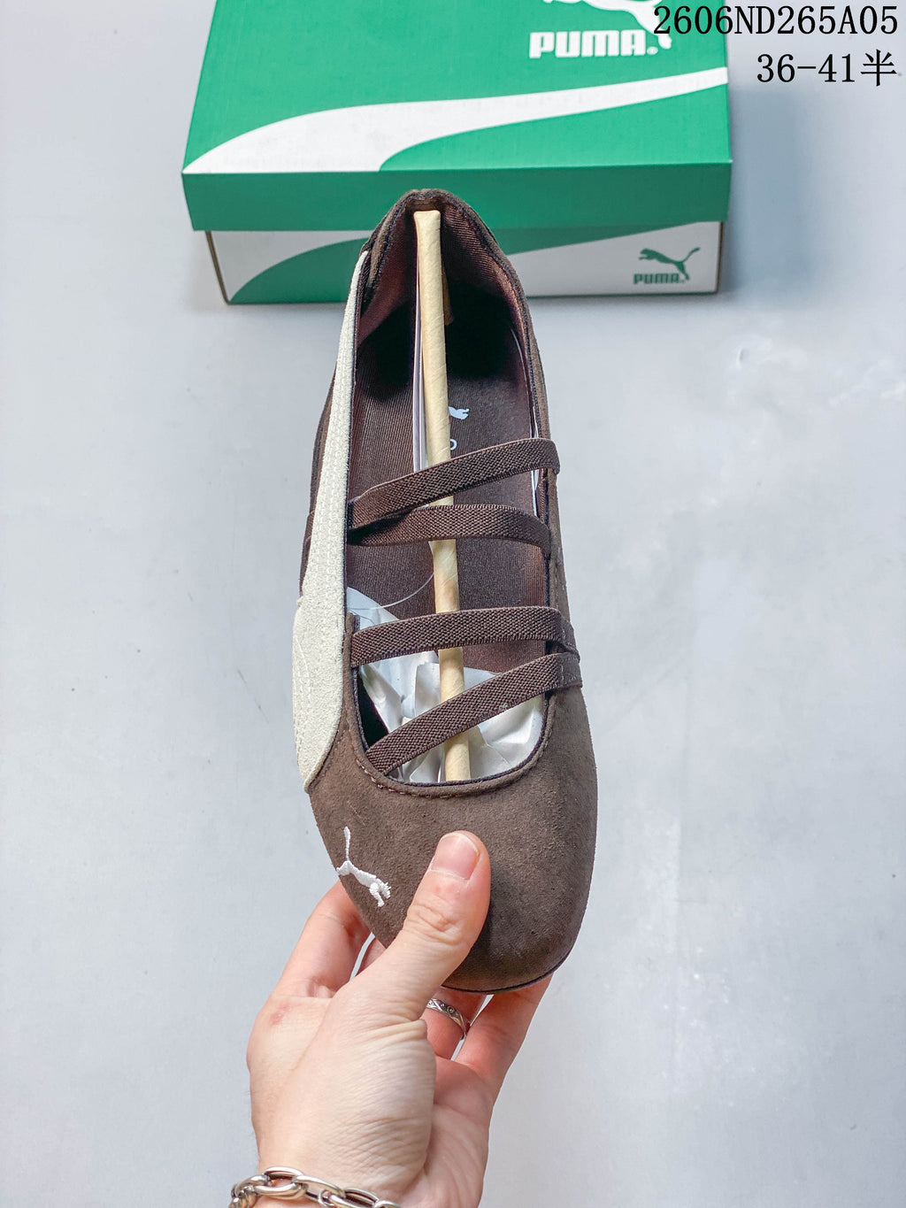 Top view of a brown PUMA Speedcat Ballet shoe with crossed elastic bands