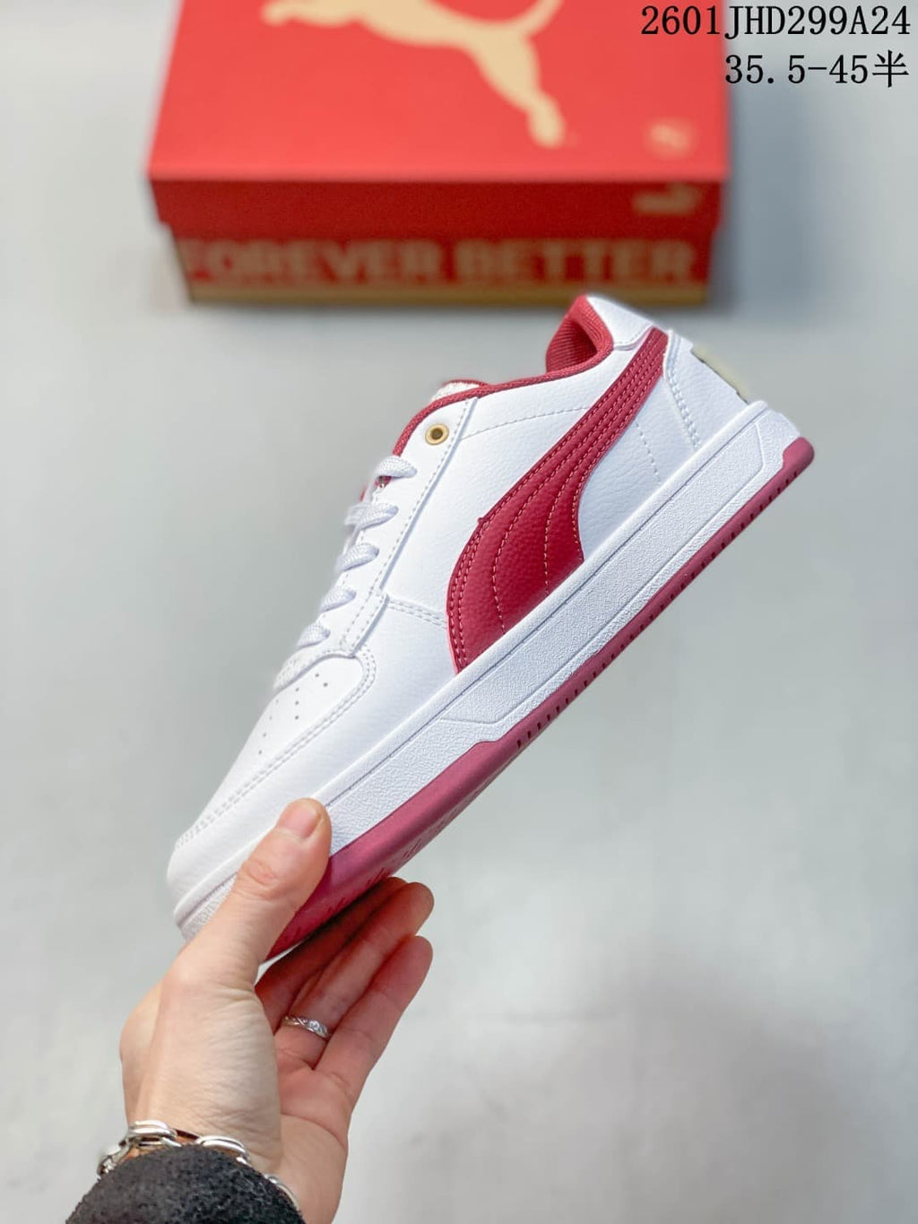 Side view of a white Puma Caven 2.0 low-top sneaker with a red side stripe