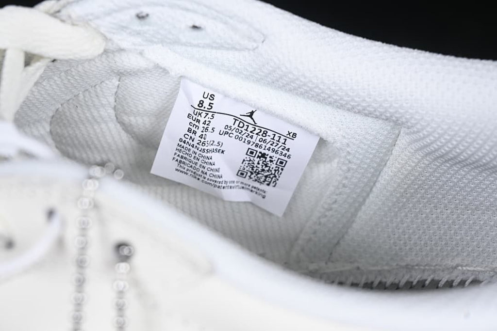 Close-up of the shoe label showing US 8.5, UK 7.5, EU 42, and model code TD1228-111.