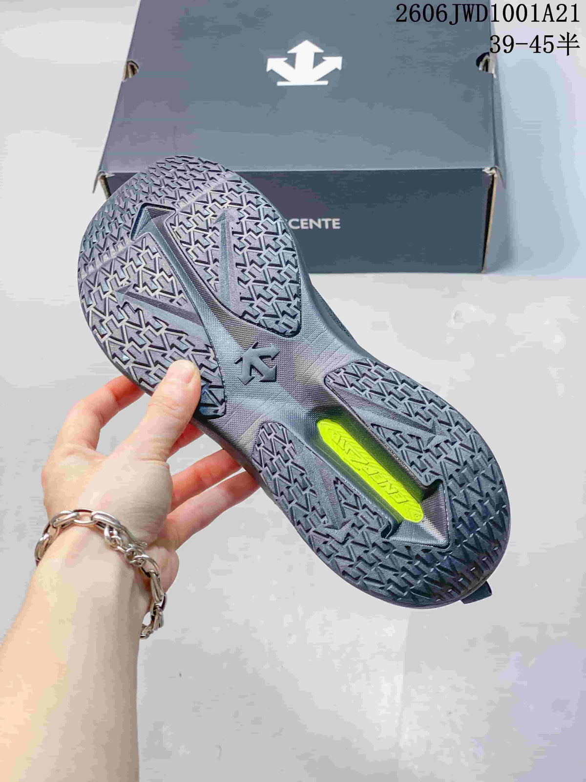 Close-up of the sneaker outsole with patterned tread and a bright accent in the midfoot