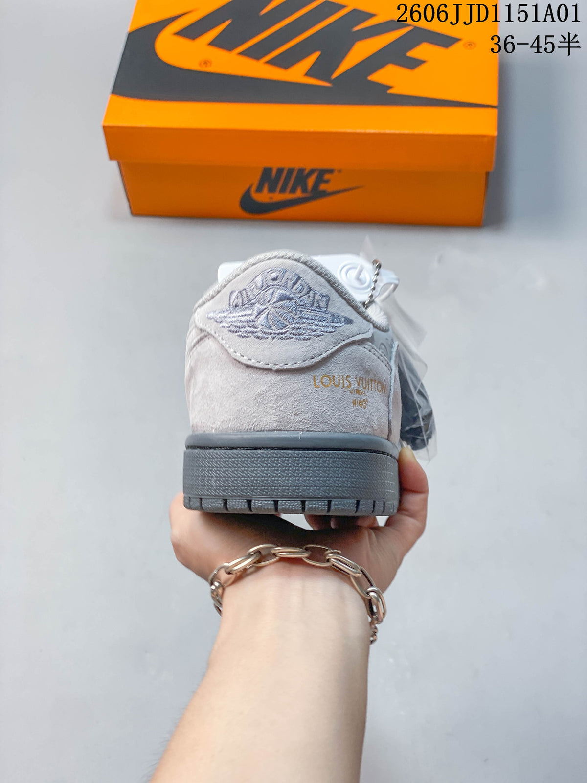 Rear view of the gray sneaker showing heel details and a contrasting outsole