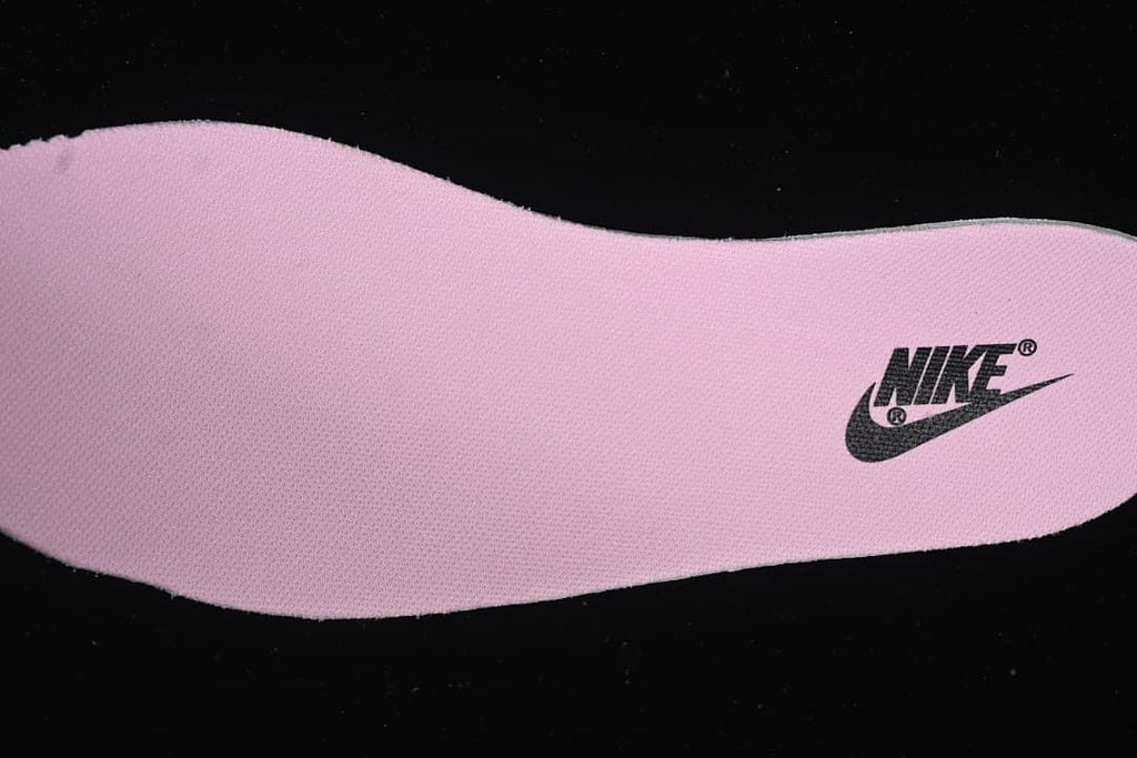 Pink shoe-shaped insert with a Nike mark