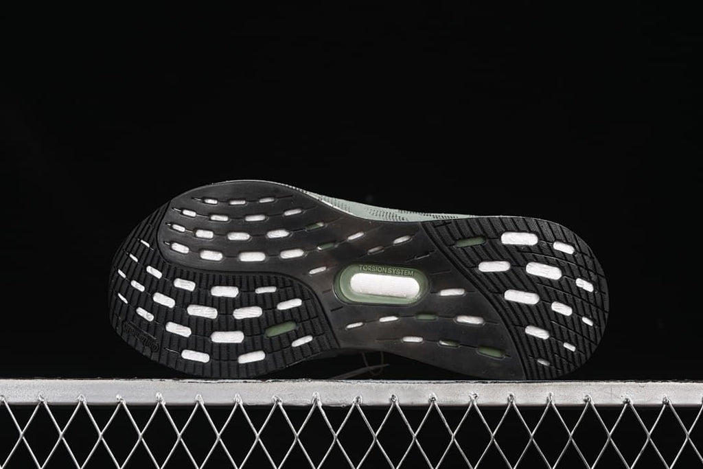 Underside view showing black tread and central torsion system marking
