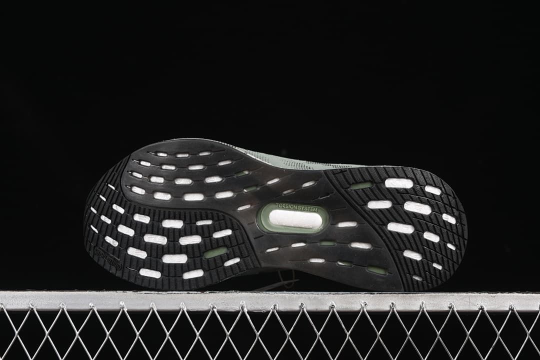 Underside view showing black tread and central torsion system marking