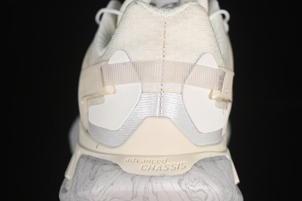 Rear view highlighting the heel structure and patterned midsole.
