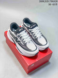 Two pairs of New Balance Ellipse V1 low-top running shoes in white with dark gray accents and a light neutral colorway.