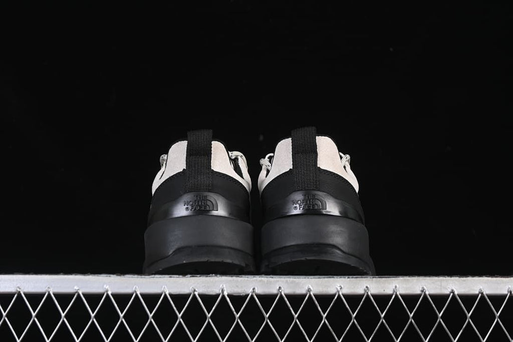 Rear view of the pair showing heel pull tabs and logos