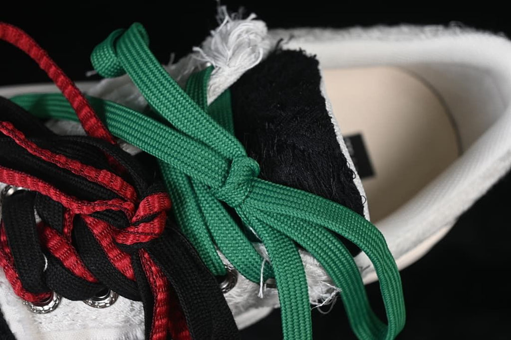 Close-up of the sneaker with additional colored laces