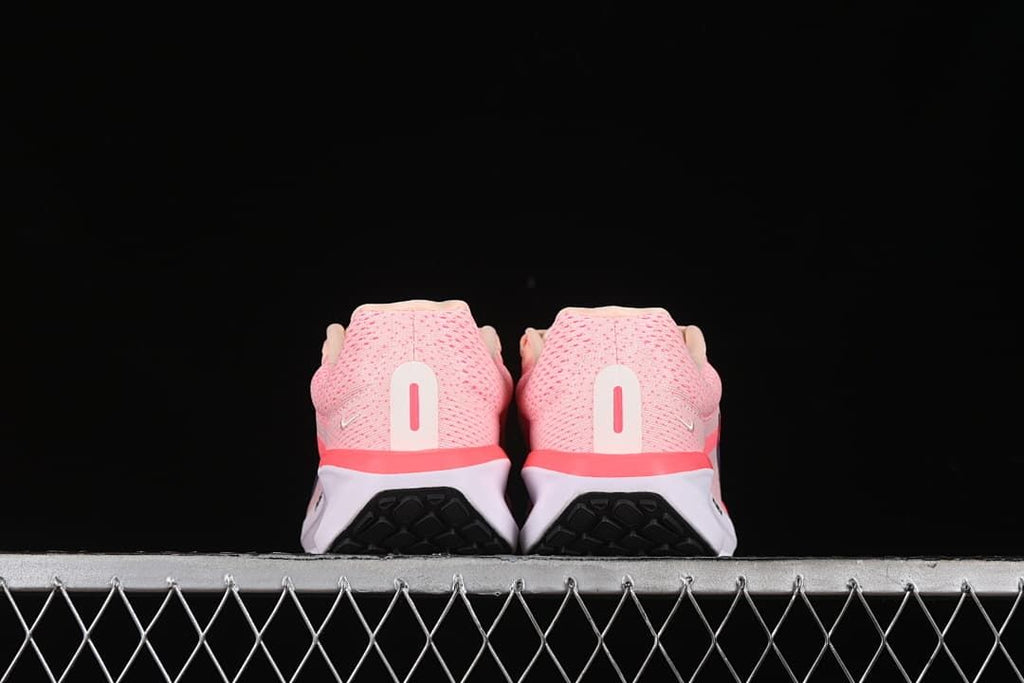 Rear view of both shoes showing the heel details and outsole.