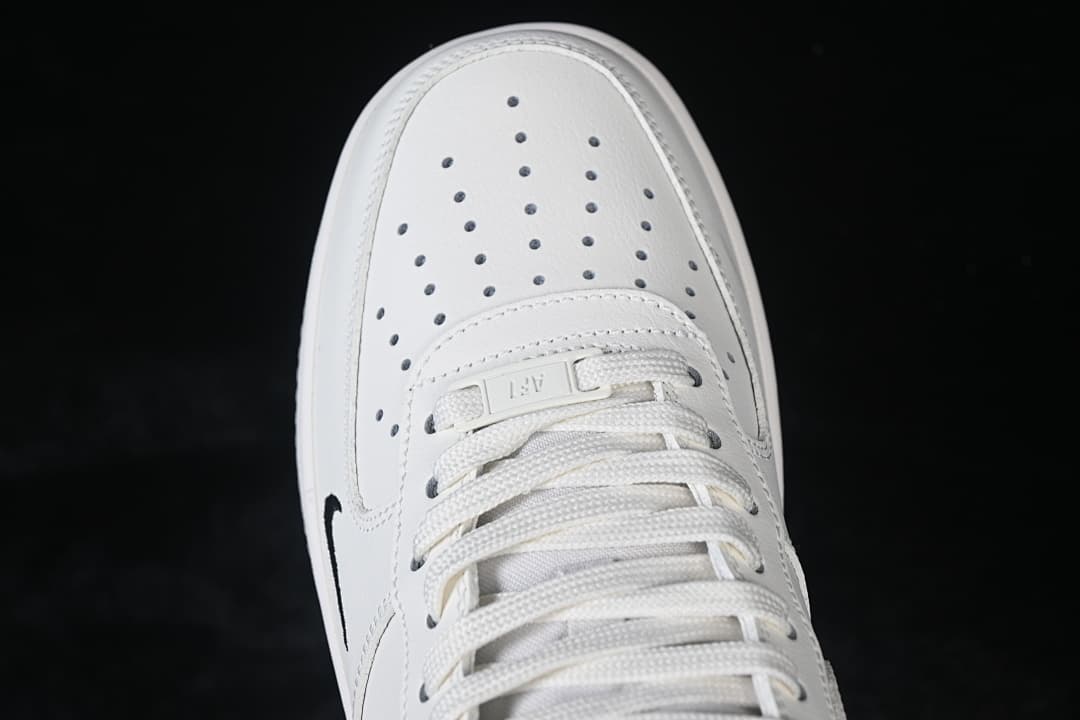 Top-down close-up of the perforated toe box and laces