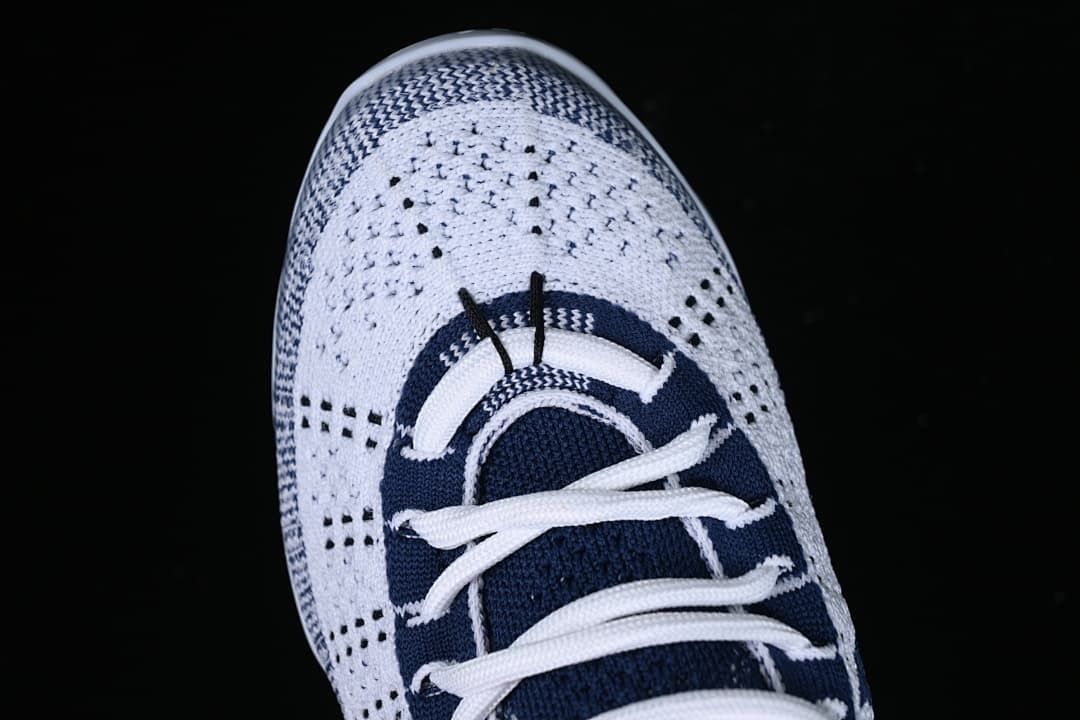 Top view of the knit toe, laces and navy tongue