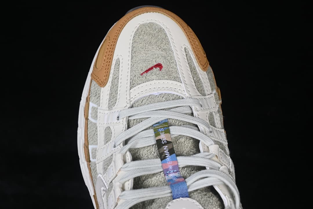 Top-down close-up of the sneaker toe and lace area