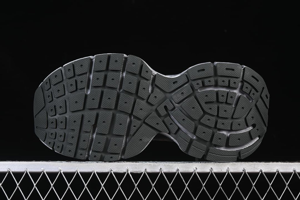 Underside view showing the patterned black outsole.