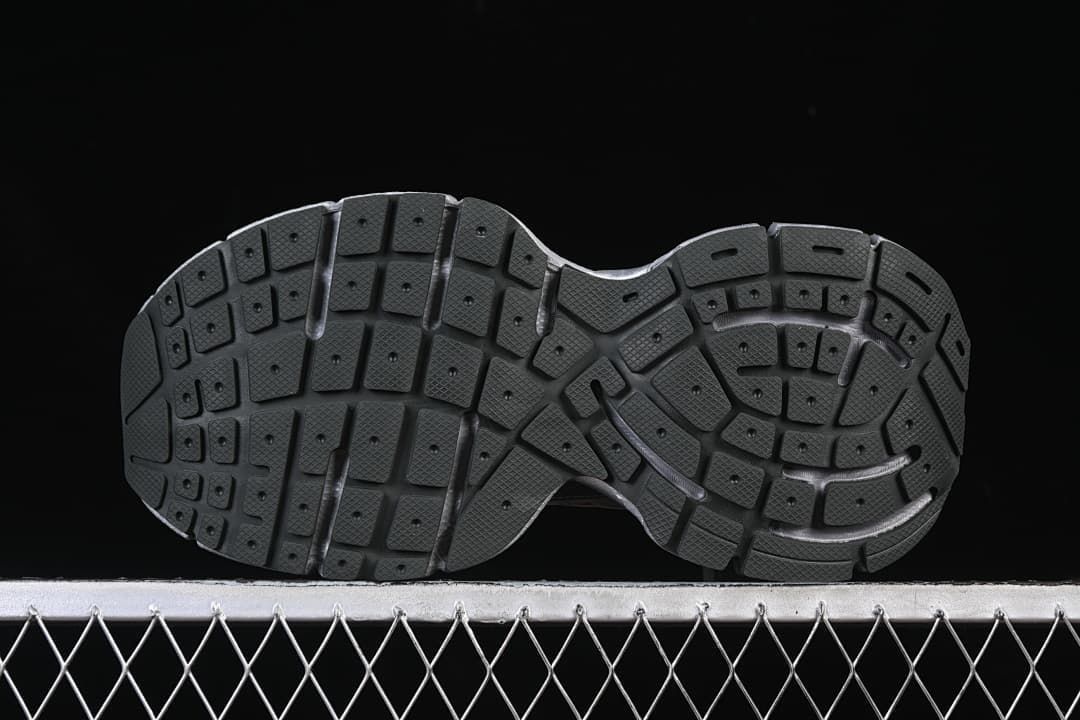 Underside view showing the patterned black outsole.