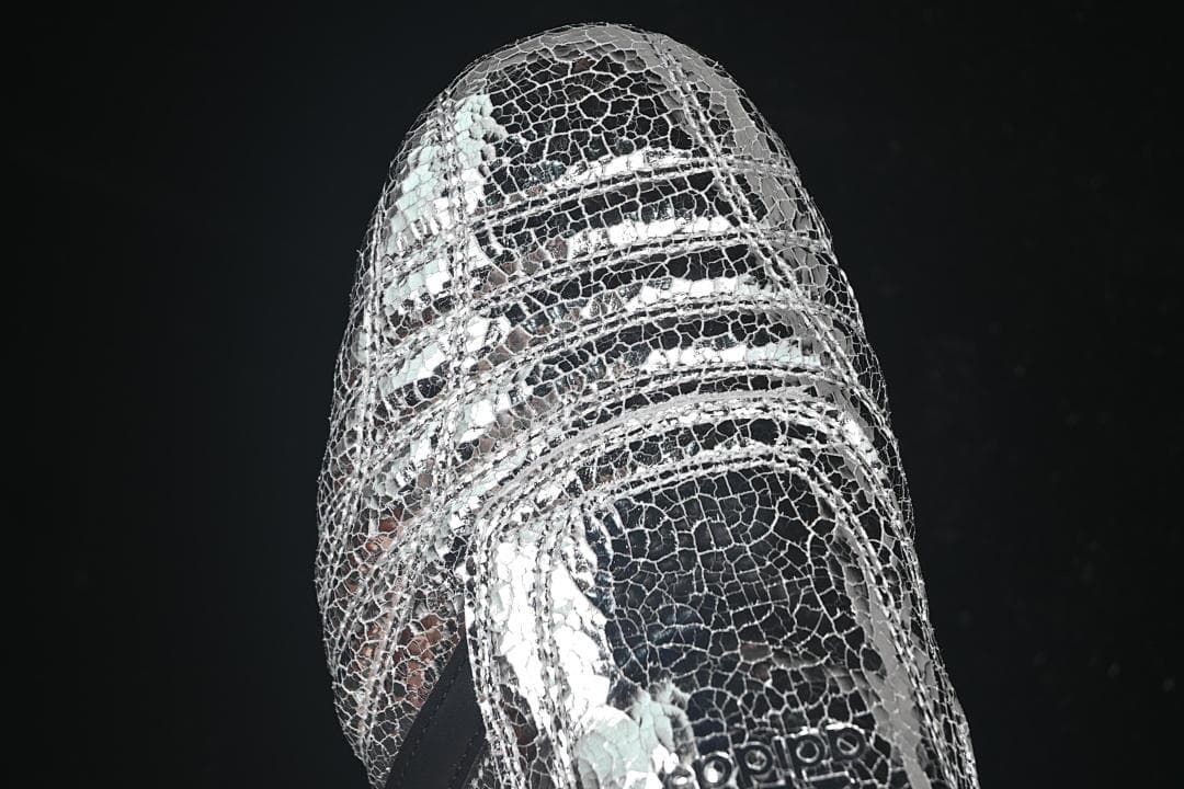 Top view of the silver metallic crackle-pattern shoes and forefoot strap.
