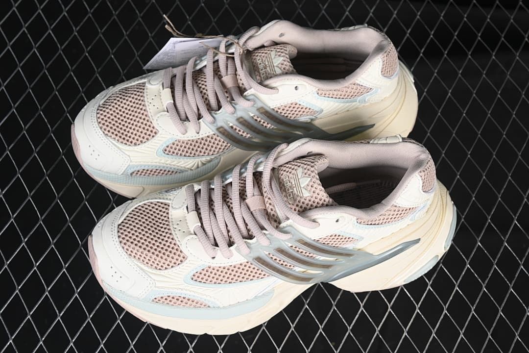 Pair of cream and pink Adidas Adistar XLG sneakers viewed from above