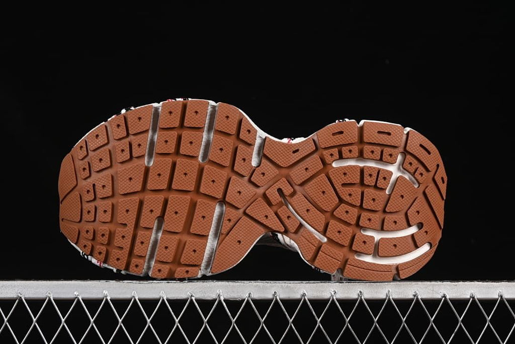 Underside view showing the brown-toned outsole tread