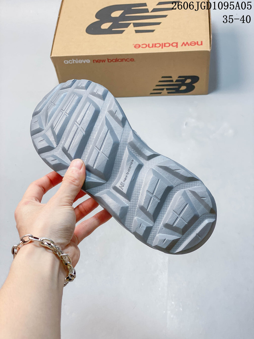 Close-up of the gray sneaker outsole showing its patterned tread