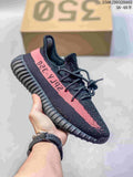 Black knit-look sneaker with a pink side stripe and ribbed dark sole